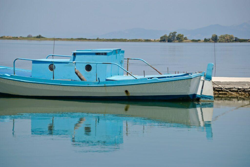 white and blue boat on water during daytime, Lefkada
